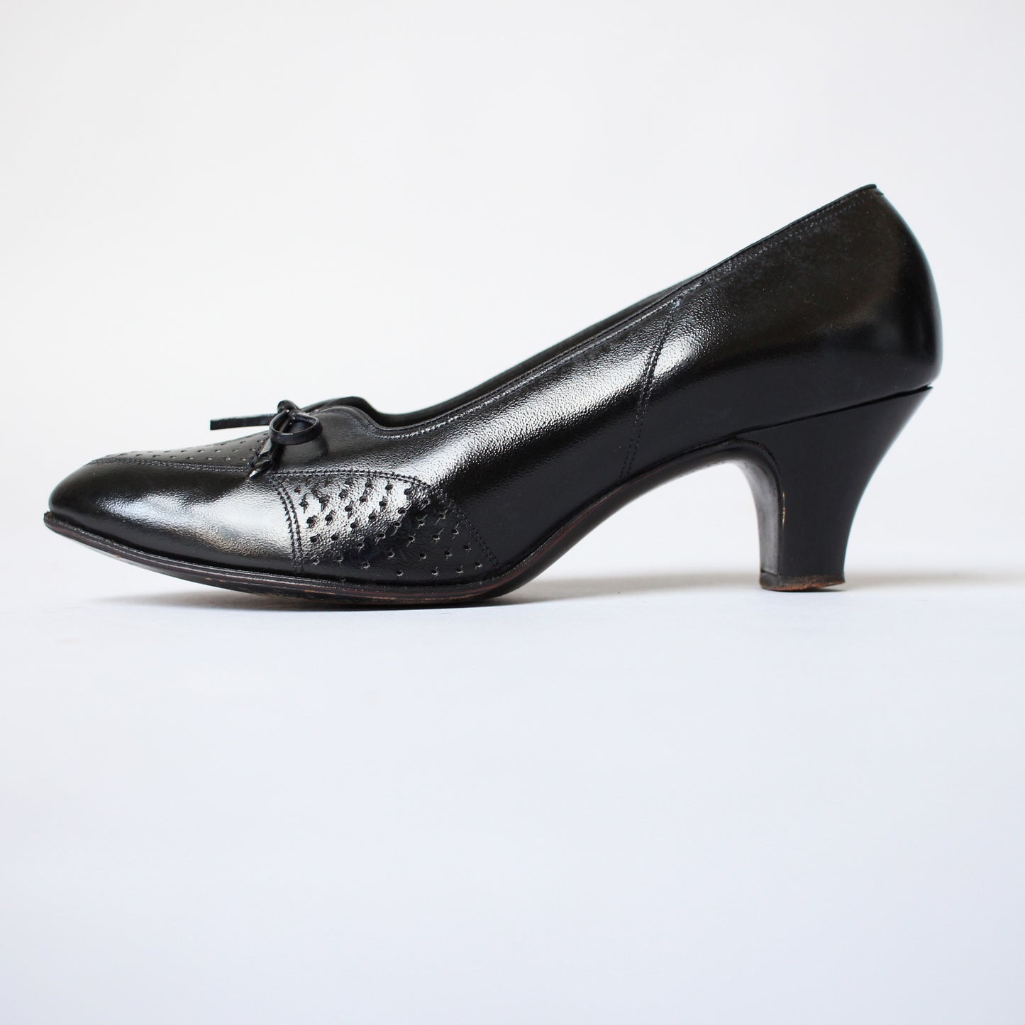 Black 1930s Perforated Heeled Flats with Bow