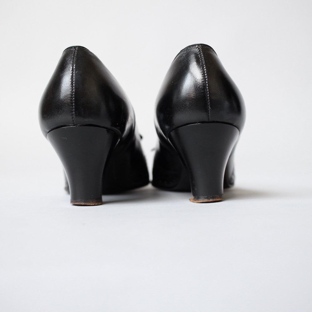 Black 1930s Perforated Heeled Flats with Bow